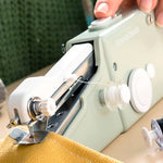 Máquina de coser manual portátil